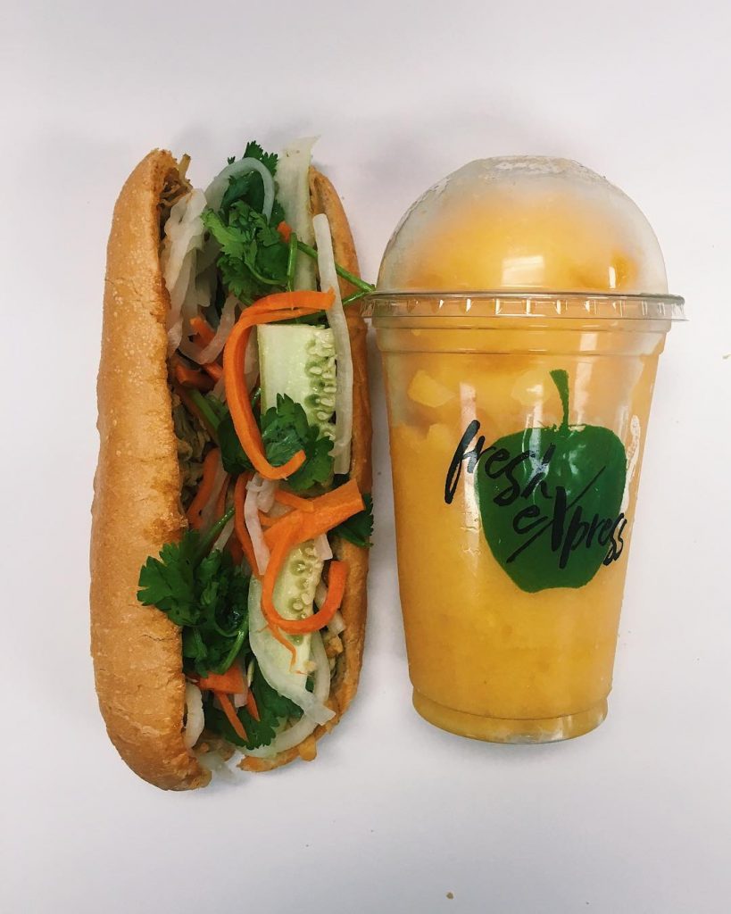 Veggie Sandwich with cup of mango. 