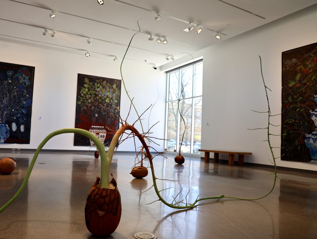 Art sculptures of steams growing out of seeds.