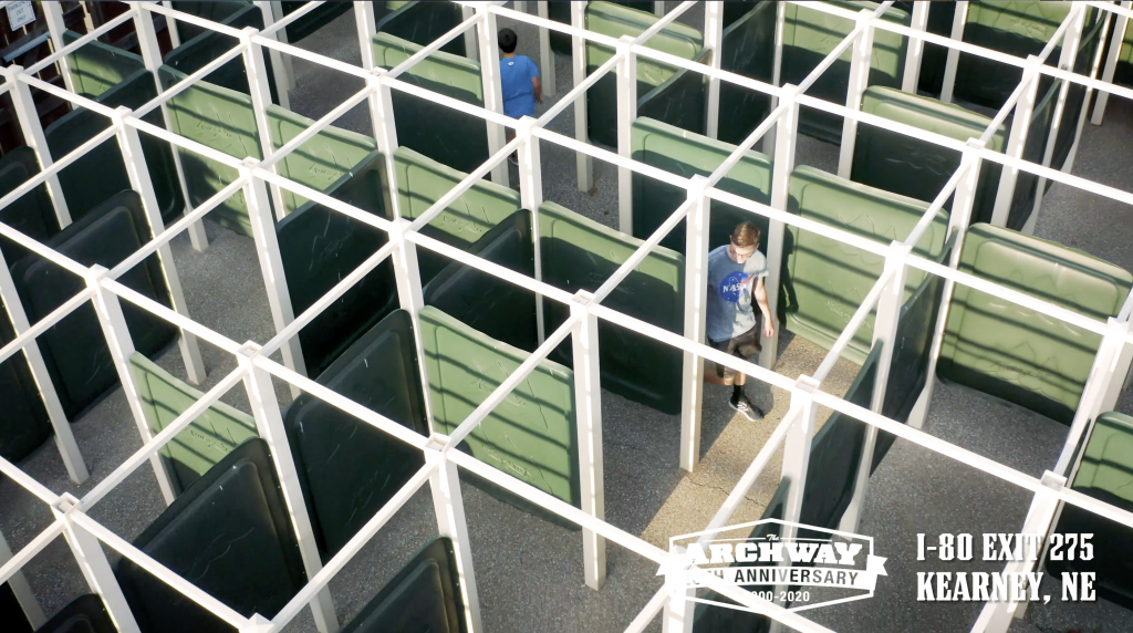 aerial view of people walking through maze. 
