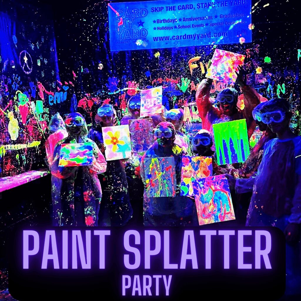 People in dark room with neon colors as they celebrate a paint splatter party. 