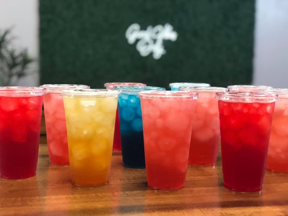 assortment of colorful iced juice drinks. 