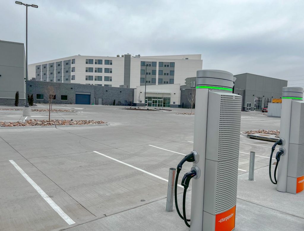 parking lot of Crowne Plaza with two electric car charging stalls.