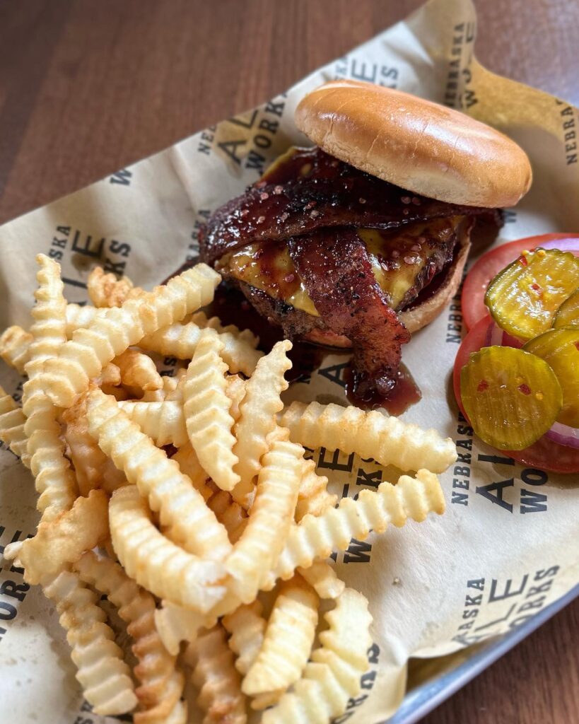 basket of French fries with cheeseburger and bacon. 