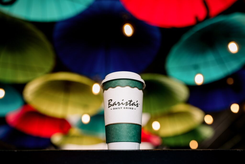 Barista's coffee cup on table 