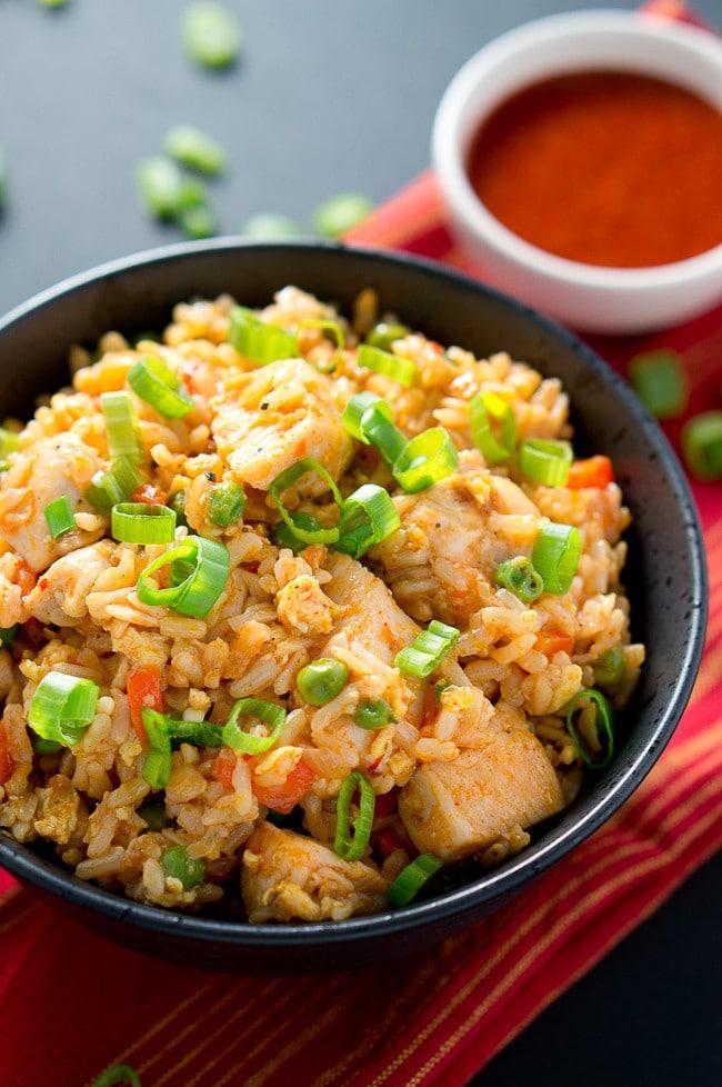 chicken fried rice tossed with chopped carrots and green onions. 