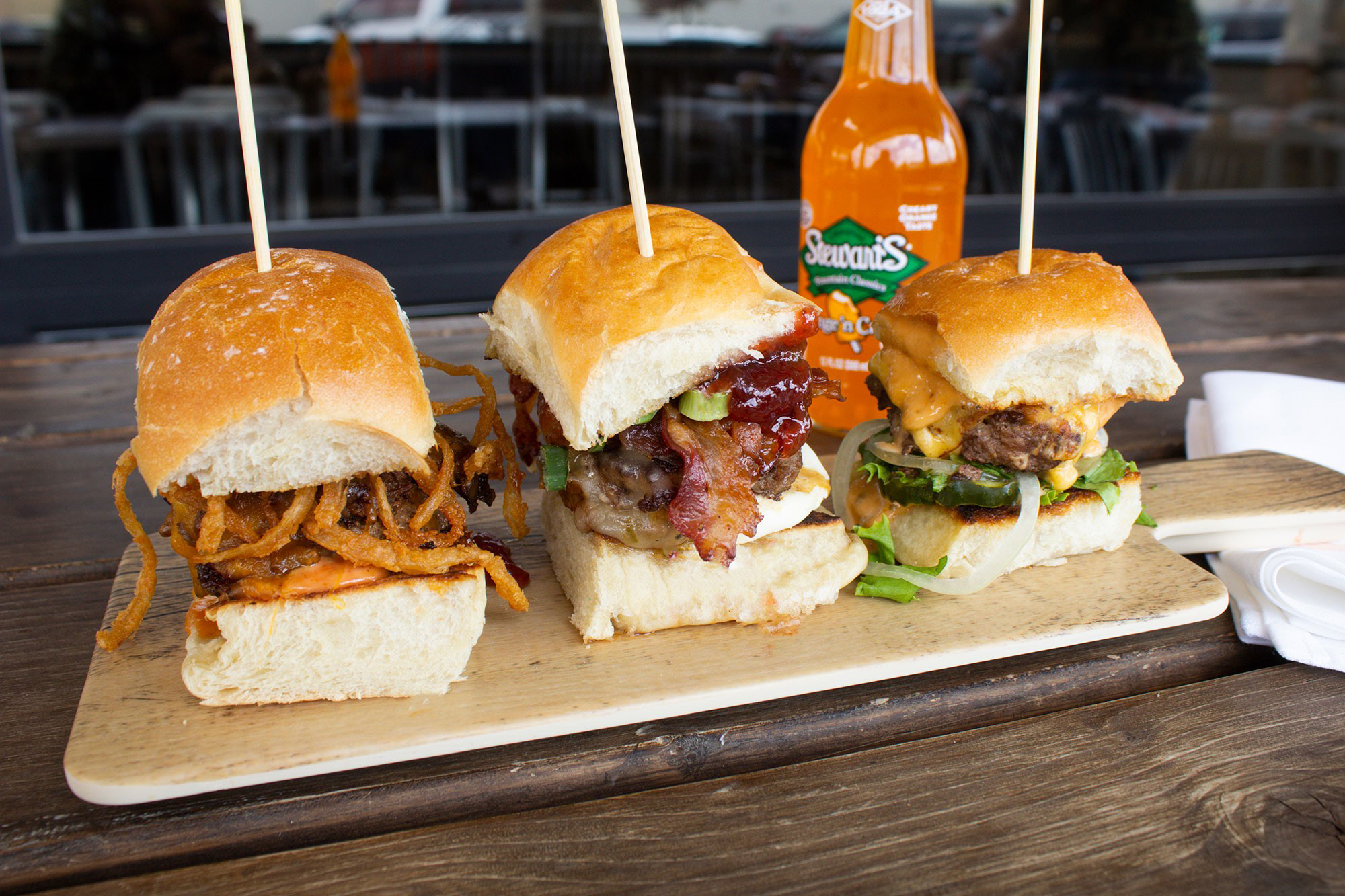 Flight of slider burgers on a table