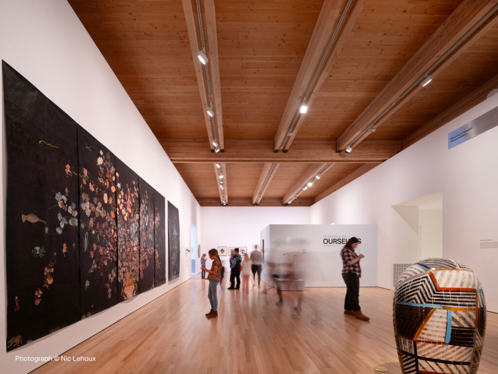 People admiring exhibition at the MONA. 
