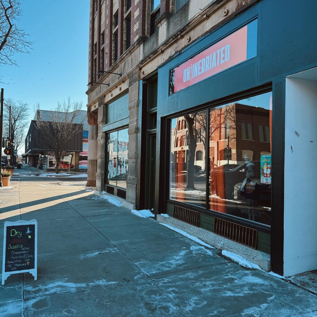 front entrance with orange Un:Inebriated sign. 