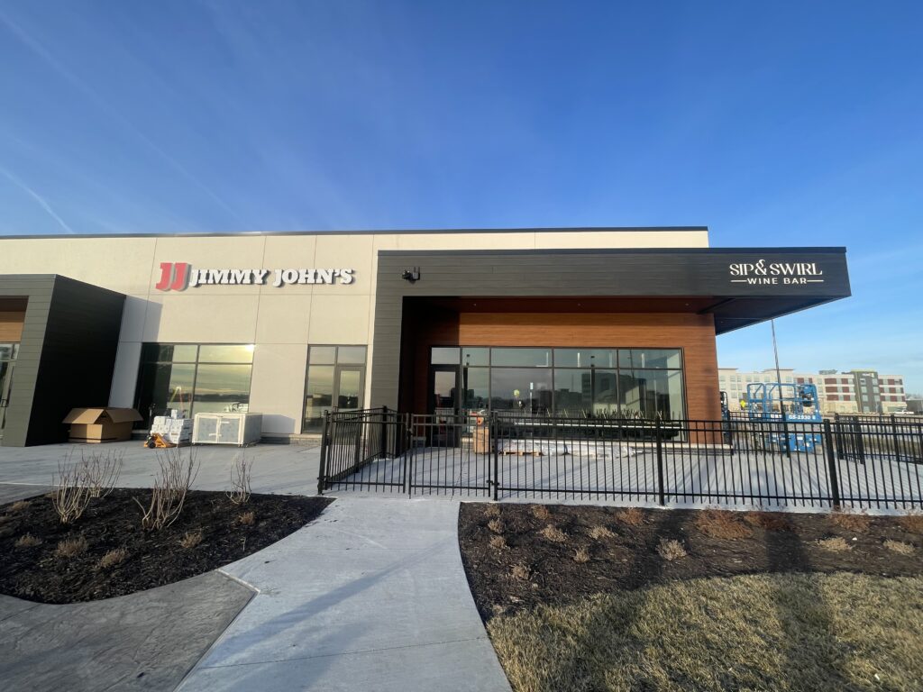 exterior of Jimmy John's with blue sky behind. 