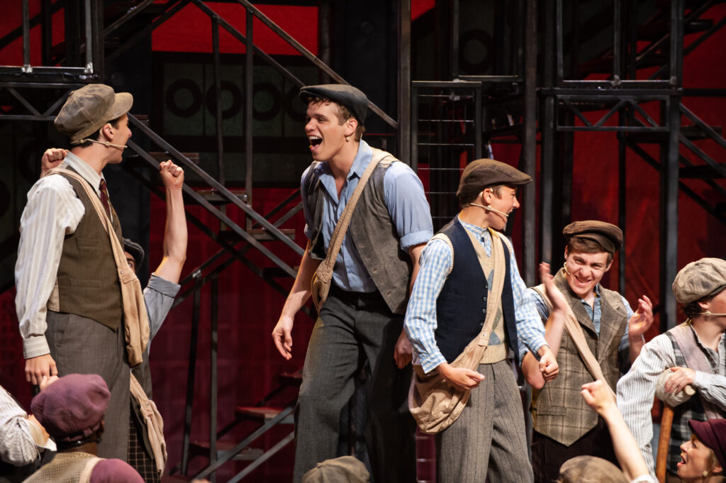 Theater performance of Newsies. 